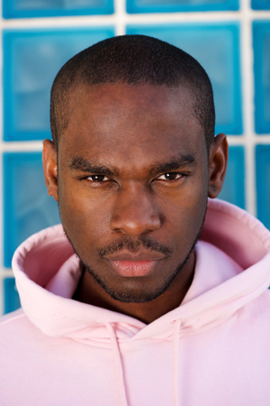Close up portrait of tough african american male fashion model staring
