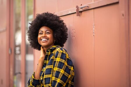 Portrait of happy beautiful young black woman with afro
