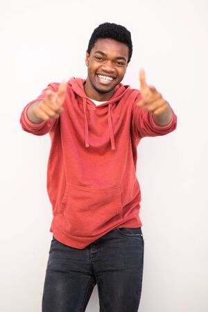 Portrait of happy young black man pointing fingersの写真素材