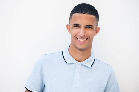 Close up horizontal portrait of smiling North African man against white background