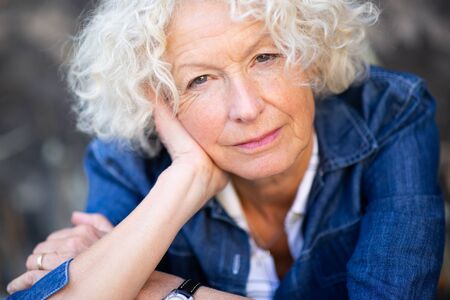 Close up front portrait serious older womanの写真素材