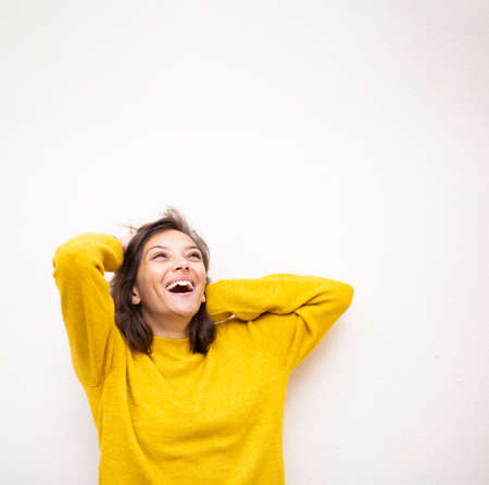 Portrait attractive young woman smiling by white isolated background