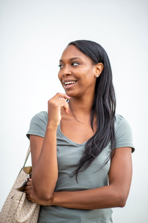 Hands of black woman and caucasian man text messaging using mobile phone at outdoor cafeの写真素材
