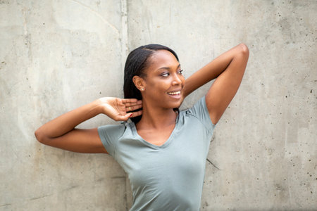 Carefree african american woman showing new car keyの写真素材