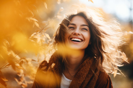 Happiness in Fall Colors:An Outdoor Portrait of Smiling Woman on a Autumn walk in Natureの素材