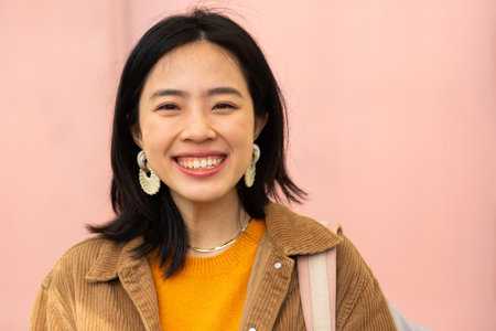 Close up portrait smiling young asian womanの写真素材