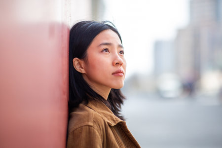 Side portrait young woman with serious expressionの写真素材