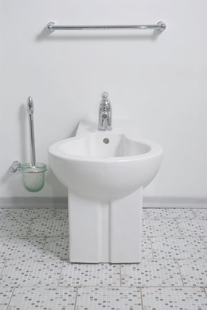 Clean white lavatory pan and toilet accessorysの写真素材