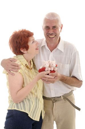 Seniou couple with toy in studio on white backgroundの写真素材