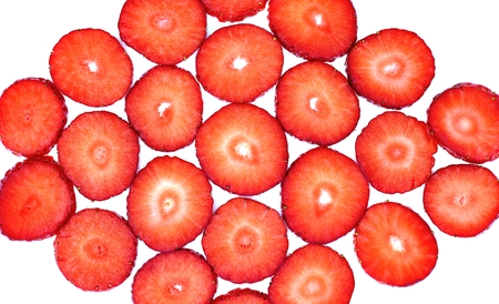 Textures, background, abstract and fruity concept: pattern with red cut strawberries on a white background.の写真素材