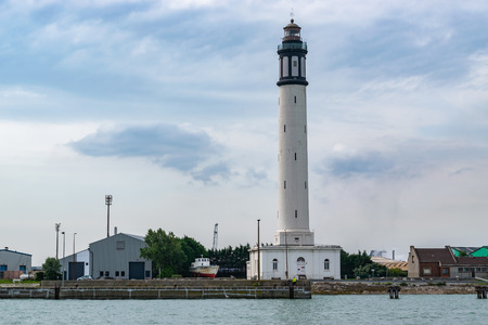 Dunkirk, FRANCE-August 23,2017: Historical dunkirk lighthouse next to the port entrance.Built in 1842, seriously damaged in 1940 during the bombing.Rebuilt in 1946, restored in 1992.のeditorial素材