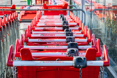 shopping trolleysRoncq, FRANCE-February 25,2018: Close-up Auchan hypermarket.Auchan is a French international supermarket chainのeditorial素材