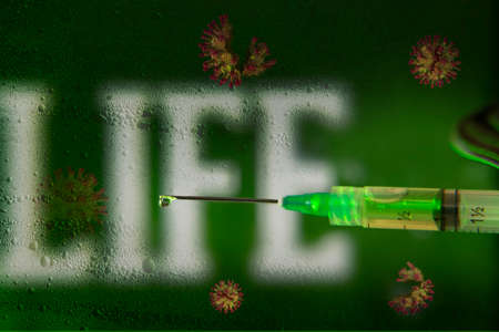 coronavirus vaccine in background with life letters