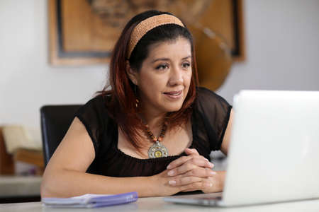 woman doing home schooling and working at home