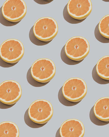 Fresh grapefruit  patttern on sandy grey background. Citrus pattern.の写真素材