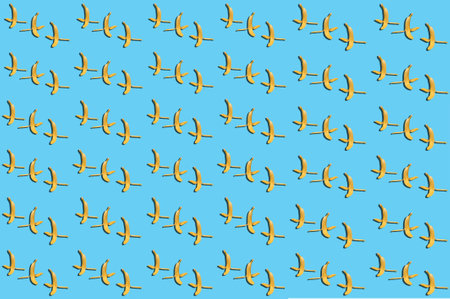 Concept of a bunch of peeled bananas on a blue backgroundの写真素材