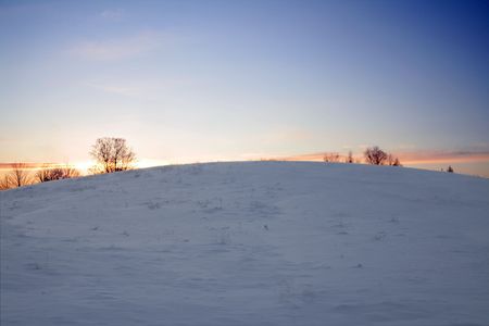 Sunset in the winter. Cold weather and blue sky.の写真素材