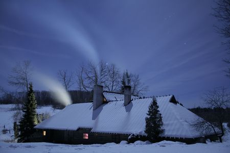 A lonly house is standing on a moonlightの写真素材