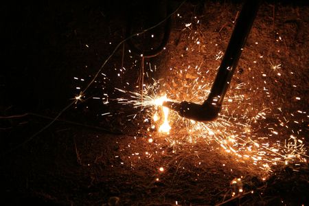Welding fire and stars are flyng around. Dangerの写真素材