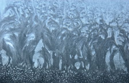 Ice flowers on the windowの写真素材