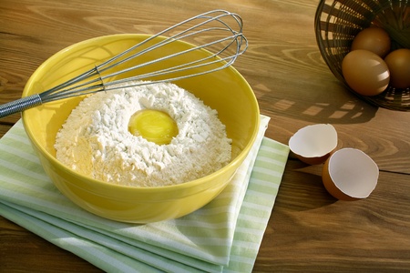 Baking ingredients for dough on a table.