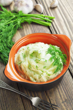 Potato puree with dill in the ceramic potの写真素材