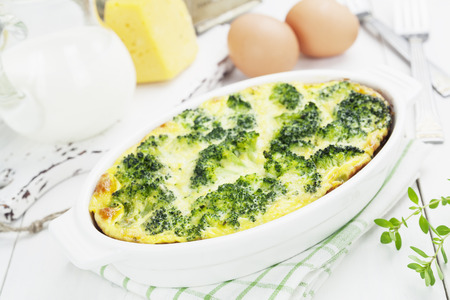 Broccoli, baked with cheese and egg in a white ceramic pot の写真素材