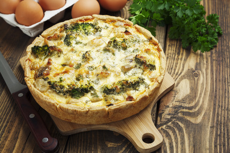 quiche Lorraine with chicken, mushrooms and broccoli on the tableの写真素材