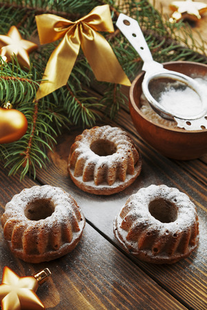 Cakes with powdered sugar on the New Year's tableの写真素材