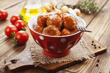 Meatballs in tomato sauce in the ceramic bowlの写真素材