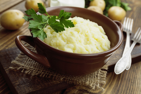 Potato puree in a ceramic bowl on the table