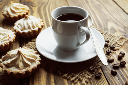 Ð¡ake and cup of coffee on the wooden tableの写真素材