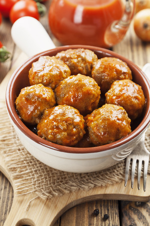 Meatballs in tomato sauce in the ceramic bowlの写真素材