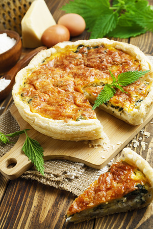 Pie with nettles and cheese on the tableの写真素材