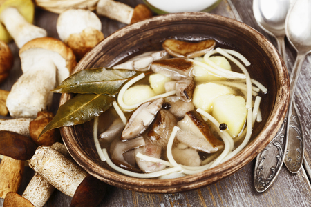 Mushroom soup in the plate on the tableの写真素材