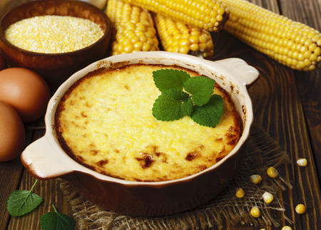 Casserole of polenta on the wooden tableの写真素材