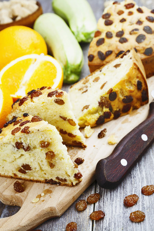 Zucchini cake with raisins and orange on the tableの写真素材