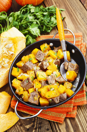 Stew beef with pumpkin in a frying panの写真素材