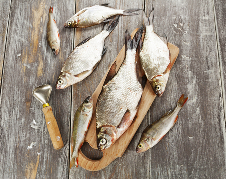 Fresh river fish on the wooden table