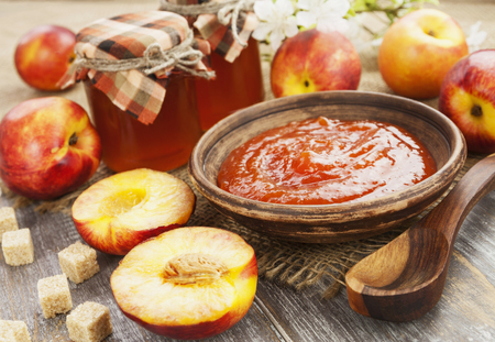 Fresh nectarines jam on a wooden tableの写真素材