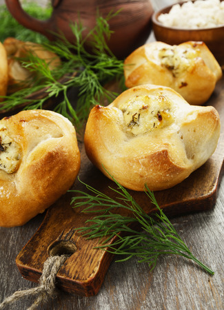 Baked buns stuffed with curd cheese and herbsの写真素材