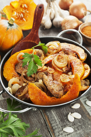 Pumpkin baked with meat  in the frying panの写真素材