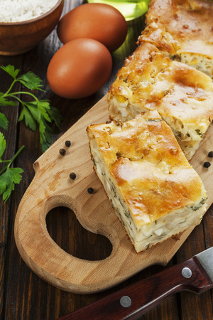 Pie with cabbage and eggs on the tableの写真素材