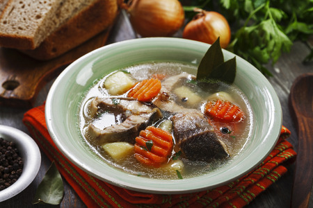 Fish soup with vegetables on the tableの写真素材