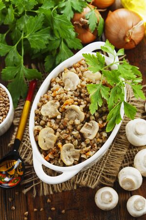 Buckwheat porridge with champignons in the bowlの写真素材