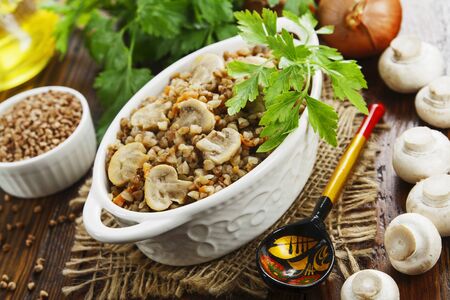 Buckwheat porridge with champignons in the bowlの写真素材