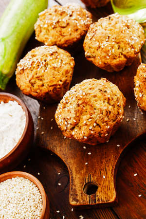 Zucchini muffins with sesame seeds on the tableの写真素材