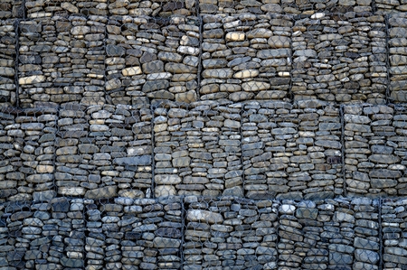 stone wall the photo shows a wall that is constructed of river stones.の写真素材