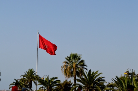 Moroccan flag. The natural image of a beautiful flag on the background of the blue sky.の写真素材