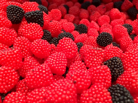 Red strawberry sweets and delicious candies. Candies shop